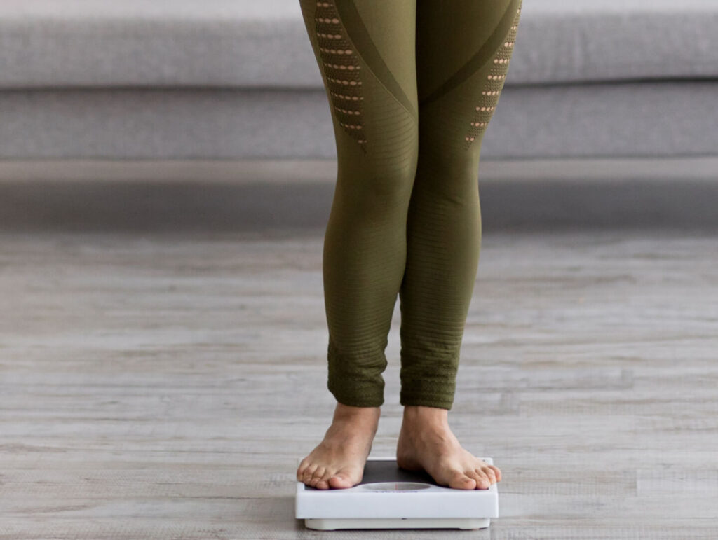 full-length-portrait-of-slim-indian-woman-measurin-2023-11-27-05-23-57-utc (1)
